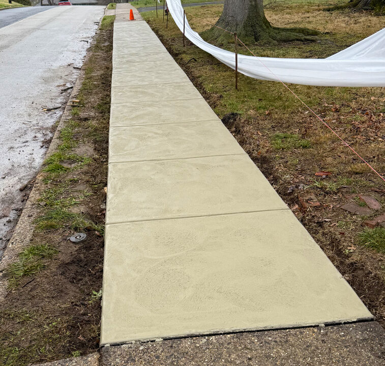 Concrete sidewalk replacement in Northeast Philadelphia by Marcello Family Cement Work